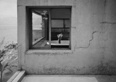 Outdoor terrace in Room One at Anzan Atitlán with expansive lake views, cement flooring.