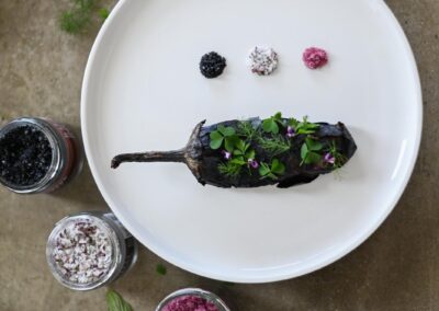 Charred Jalapeño starter at Anzan Table’s Special Dinner ( 12 plates )— served with fresh garden herbs and three types of Icelandic salt, presented as part of an exclusive tasting menu at Lake Atitlán.