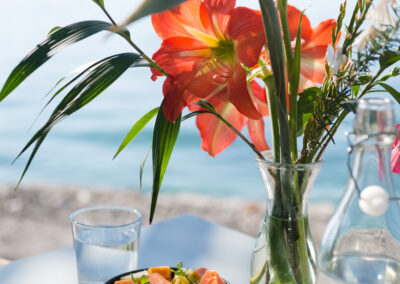Seasonal fruit salad at Anzan Table by the shores of Lake Atitlán — a vibrant vegetarian breakfast with tropical fruit, served by the beach with panoramic lake views.