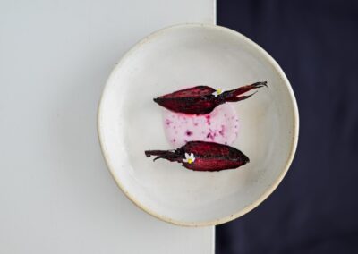 Crispy beetroot slices baked and slowly fried in organic coconut oil, half raw and half tender, served at Anzan Table as a seasonal vegetarian dish by Lake Atitlán.